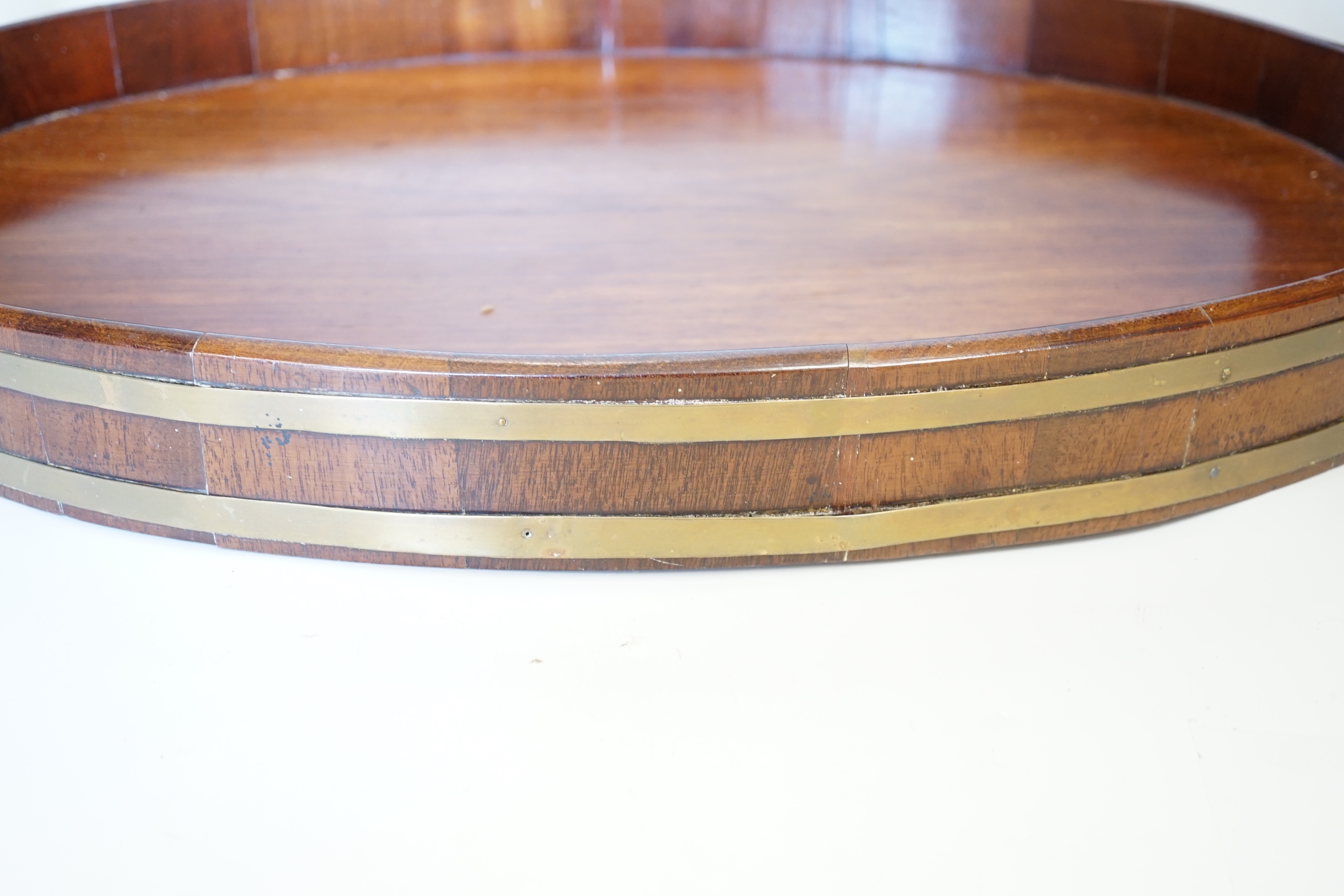 A late Georgian brass-bound mahogany tray, 58cm wide